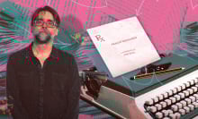 A man stands next to a typewriter with a piece of paper in the top indicating a screenplay.