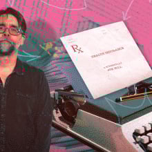 A man stands next to a typewriter with a piece of paper in the top indicating a screenplay.