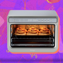 Ninja air fryer arranged on swirly orange and purple Prime Day themed backdrop