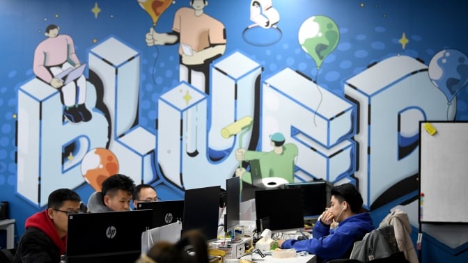 2020 photo of employees working at the BlueCity headquarters in Beijing