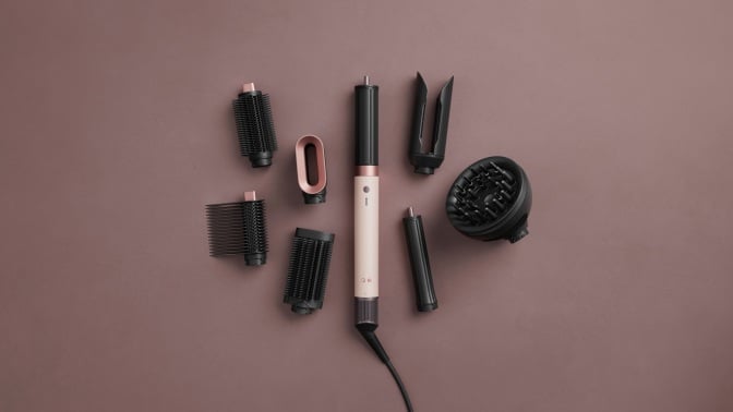 new dyson airwrap co-anda 2x with attachments on purple background