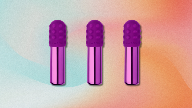Three bullet vibrators are lined up against a gradient background of pastel blues, pinks, and oranges. The vibrators have a smooth, metallic base and a textured, rounded head.