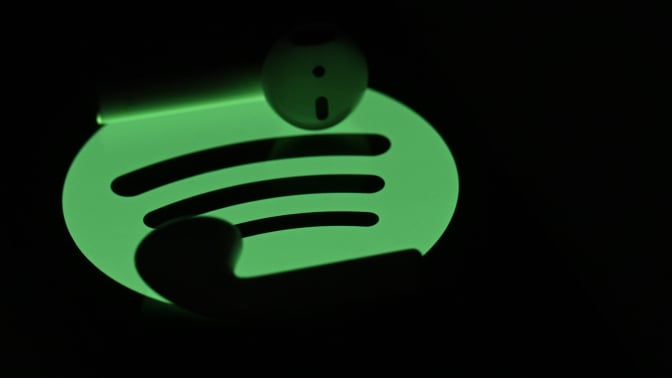 spotify logo with headphones by it