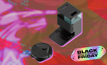 iRobot Roomba 405 robot vacuum heading toward Auto Empty Dock, arranged on pink backdrop with "Black Friday" tag in corner