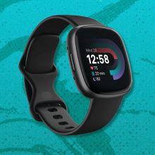 Fitbit Versa 4 with teal background