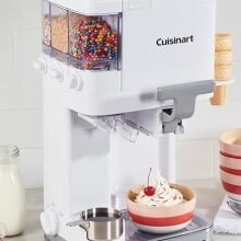 the Cuisinart Mix It In Soft Serve Ice Cream Maker  with various ice cream and toppings around the machine