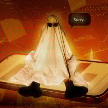 person in ghost costume wearing sunglasses saying sorry. they sit on top of a smartphone