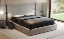 the eight sleep pod bed system on a mattress in a bright and clean bedroom 