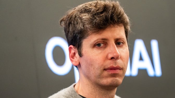 Sam Altman looking pensive before an OpenAI logo.