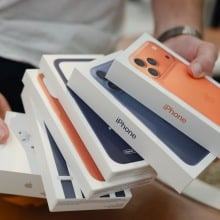 A person holds Apple's new iPhone 17 Pro Max boxes in apple store