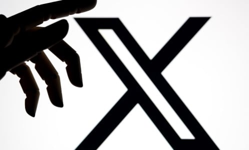 X logo with robot hand