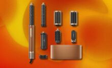 the Dreame airstyle pro on an orange background