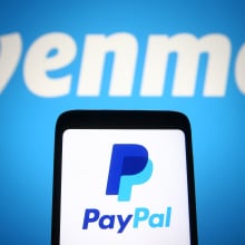 the paypal logo on a phone in front of the venmo logo