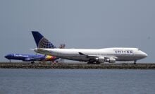 There's no ban on carrying comics—or any other type of books—in checked bags