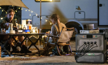 father and daughter enjoying campsite with Bluetti solar generator hooked up