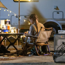 father and daughter enjoying campsite with Bluetti solar generator hooked up
