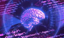An illustration of a brain surrounded by purple code.