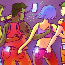 backs of four people with their hands in each others' back pockets taking a selfie together