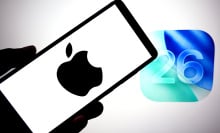  Apple logo is seen displayed on a smartphone with an IOS 26 logo in the background