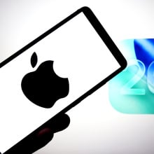  Apple logo is seen displayed on a smartphone with an IOS 26 logo in the background