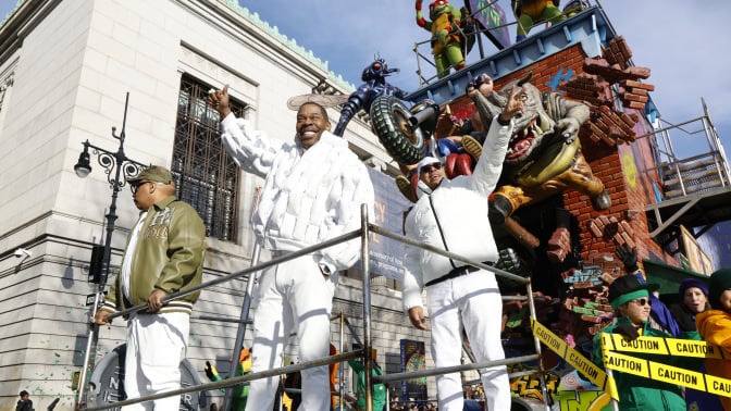 Busta Rhymes on the World of the Teenage Mutant Ninja Turtles float during the 2025 Macy's Thanksgiving Day Parade