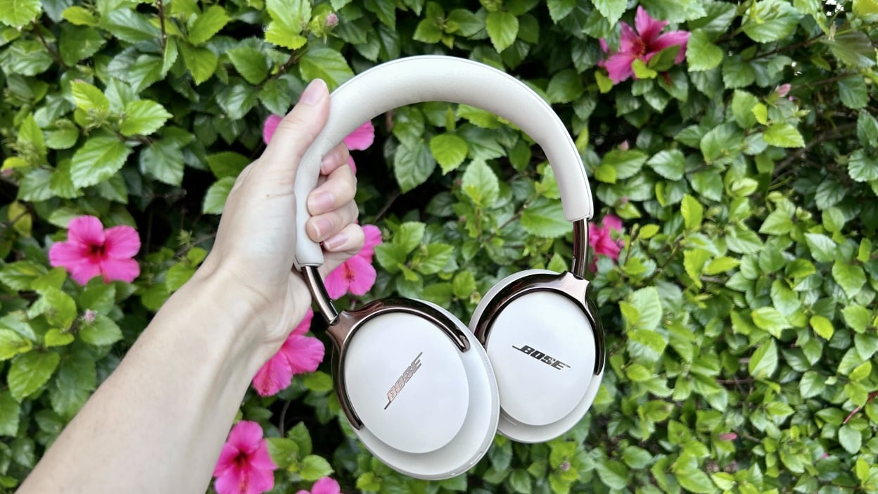 bose qc ultra headphones in front of flowers