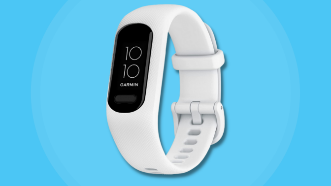 white fitness tracker against blue background