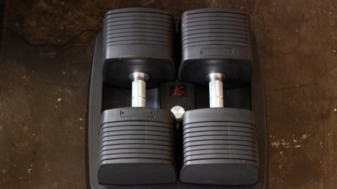 set of adjustable dumbbells with number 15 on LED panel