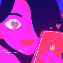 a woman looking at her phone with heart eyes