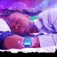 A person sleeping while wearing a sleep tracker surrounded by a dreamy graphics.