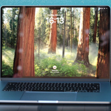 the 15-inch m4 apple macbook air on a desk against a blue speckled wall