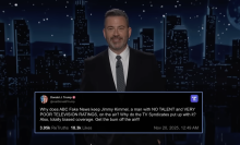 A man in a suit stands on a talk show stage. At the bottom is a screenshot of a post from Truth Social.