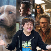 a woman smiling with open arms in front of a collage of movie posters