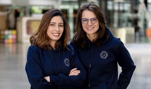 Two women posing for a picture.