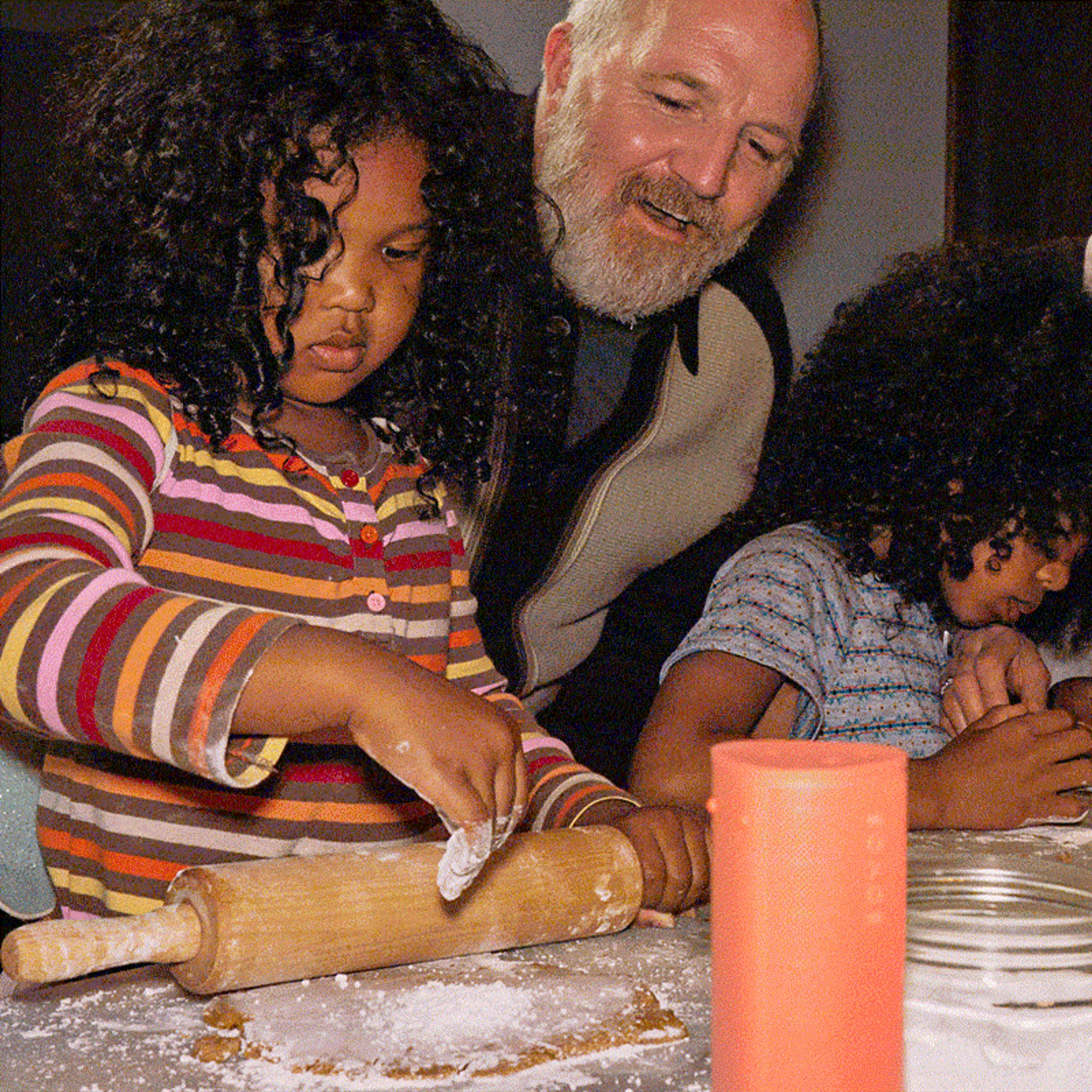 A family baking holiday cookies together