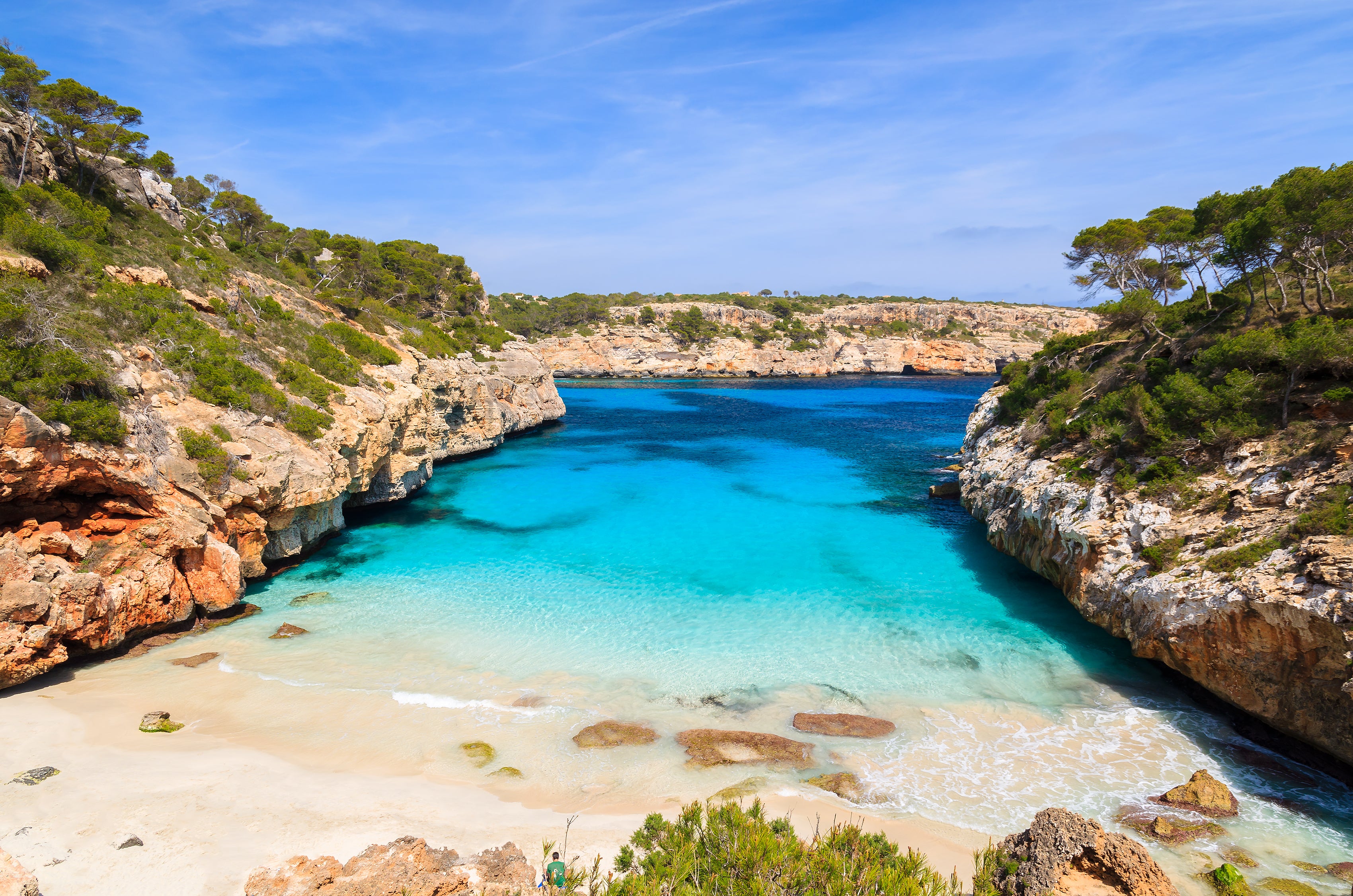 Caló des Moro beach in Mallorca is home to clear turquoise water and powder-soft sand